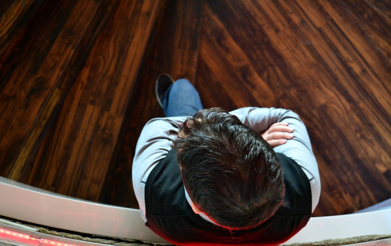 man sitting with arms crossed