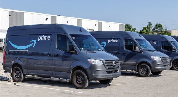 Amazon delivery vans in a parking lot